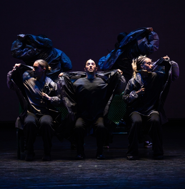 a group of people sitting on top of a chair