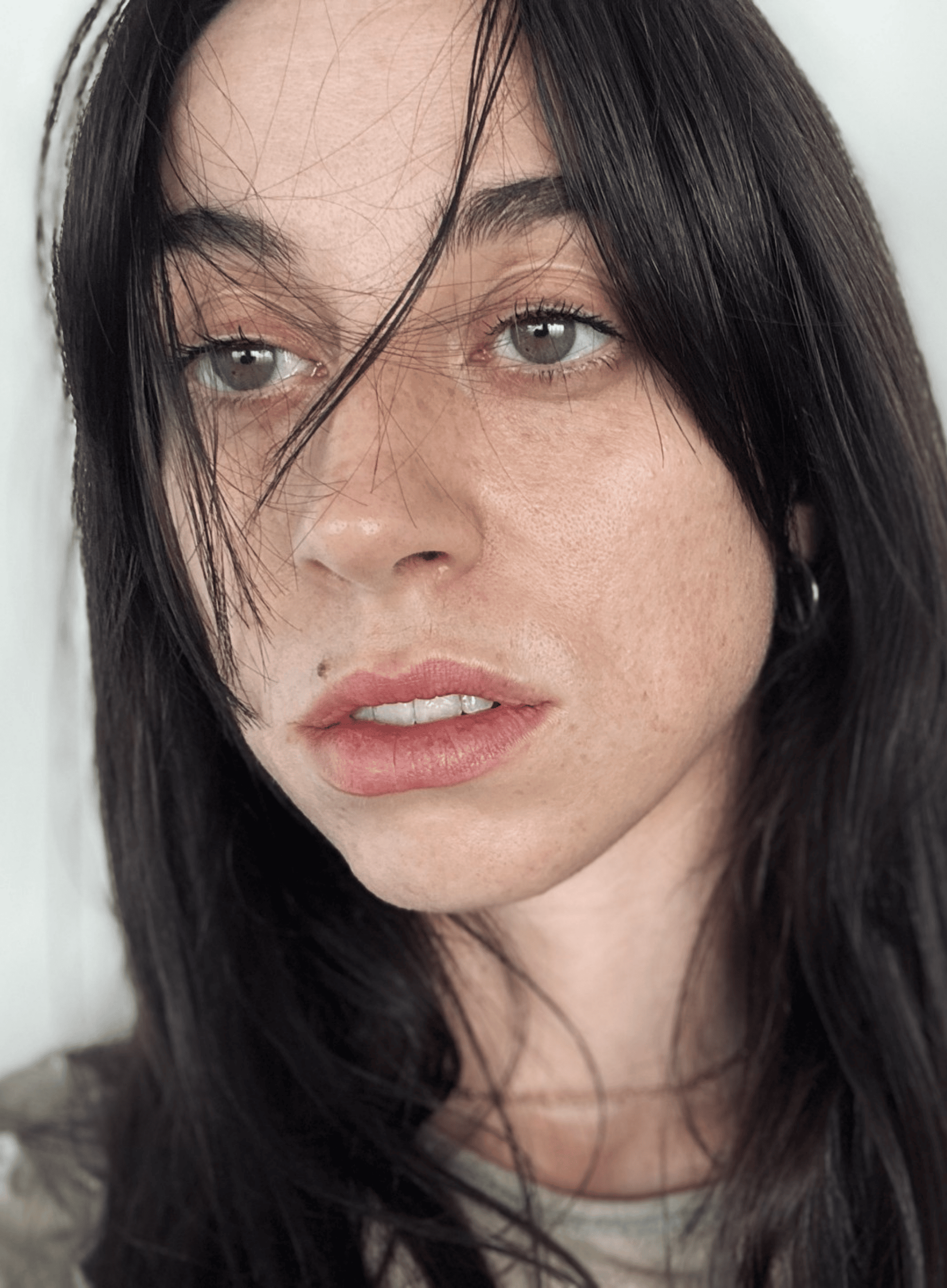 Headshot of Harriet Waghorn, a fair skinned woman in her 30s with long dark, straight hair.