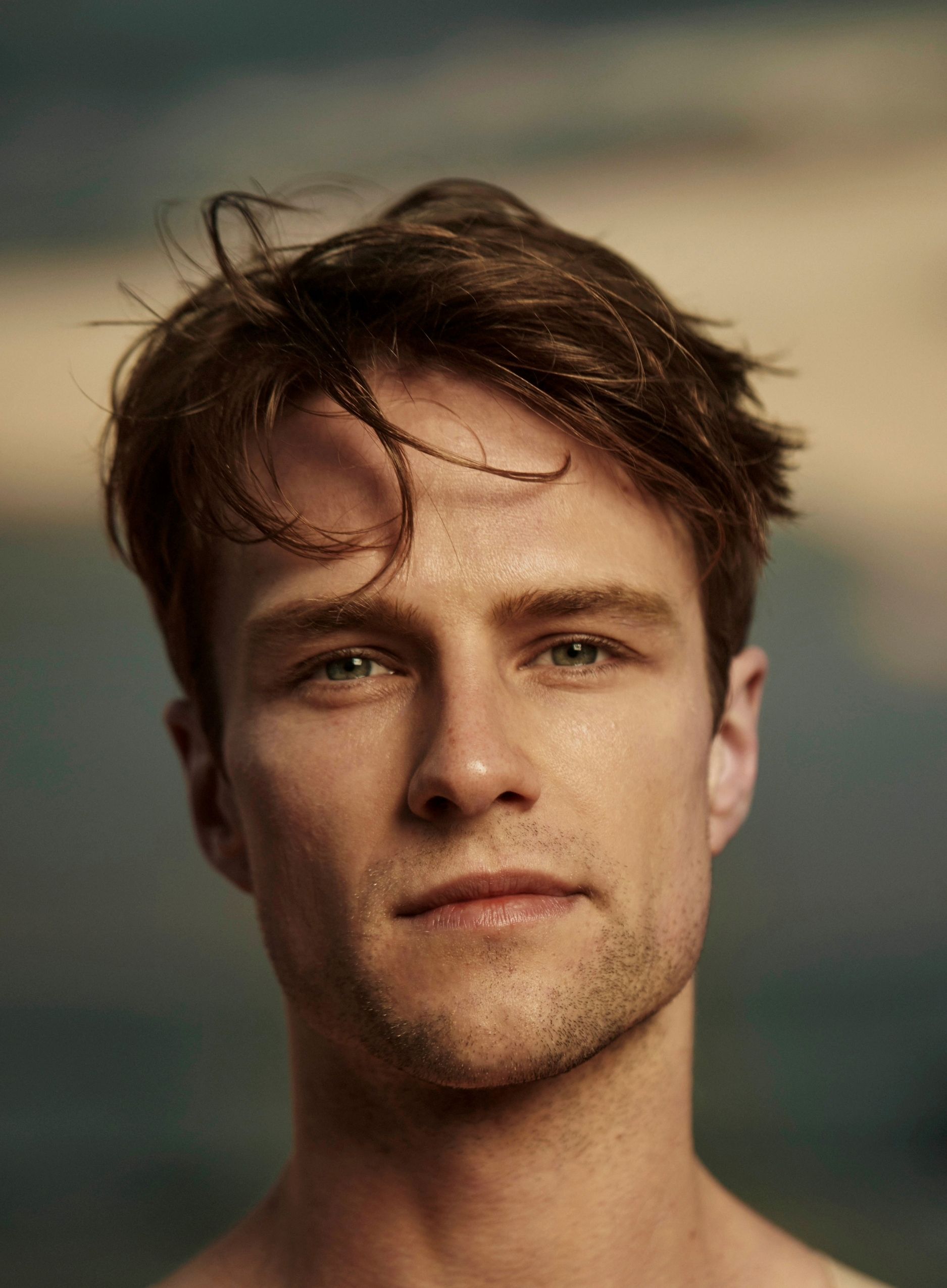 Headshot of Chris - a white man in his 30s with brown hair and brown eyes